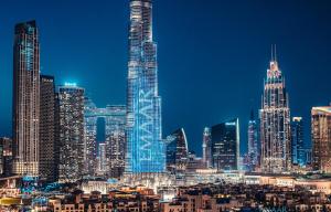 a view of a city skyline at night at Elite Royal Apartment - Panoramic Full Burj Khalifa, Fountain & Skyline view - Baron in Dubai