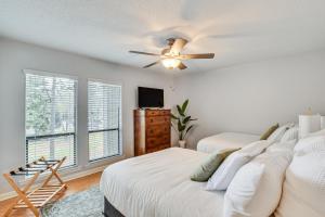 a bedroom with two beds and a ceiling fan at Pinehurst Condo Rental Near Golf with Pool Access! in Pinehurst