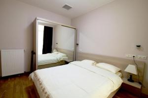 Postel nebo postele na pokoji v ubytování BBC Apartment