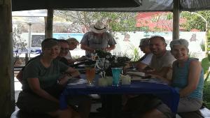 a group of people sitting at a table at the Farmhouse Restaurant Guesthouse Beergarden PTY LTD in Outjo