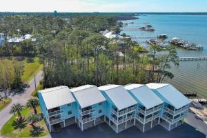 an overhead view of a row of houses next to the water at Bring Your Boat! 2br/2ba Condo on the Bay! in Orange Beach