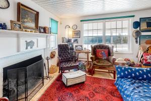 a living room with a couch and a fireplace at Mountain Vista - Main House in Hesperus