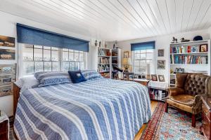 a bedroom with a bed and a chair at Mountain Vista - Main House in Hesperus +27 photos