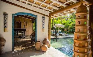 an entry to a house with a swimming pool at Hotel Boutique Perainda in Trancoso