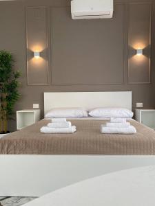 Postel nebo postele na pokoji v ubytování Quintino Sella suites
