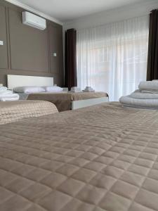Postel nebo postele na pokoji v ubytování Quintino Sella suites