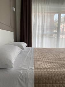 Postel nebo postele na pokoji v ubytování Quintino Sella suites