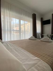 Postel nebo postele na pokoji v ubytování Quintino Sella suites