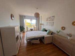 Giường trong phòng chung tại Encanto Comillas