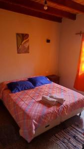 Łóżko lub łóżka w pokoju w obiekcie Casa Manipa -3 dormitorios