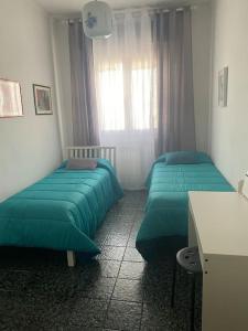 Cama o camas de una habitación en Casa vacanza in Puglia da Ada