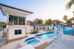 a house with a pool and a water slide at Di Pool Villa Hunhin 2km from beach in Hua Hin