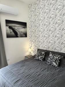a bedroom with a bed with two pillows at Penta House in Fisciano