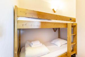 Łóżko lub łóżka w pokoju w obiekcie Résidence Le Roselend - maeva Home - Appartement 3 Pièces 6 Personnes - Sélection MAE-0983