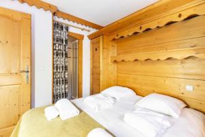 Łóżko lub łóżka w pokoju w obiekcie Résidence Le Roselend - maeva Home - Appartement 3 Pièces 6 Personnes - Sélection MAE-0983