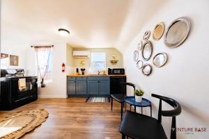 a kitchen with a table and chairs in a room at Trailblazer's Retreat, Venture Base Unit 3 in Kanab