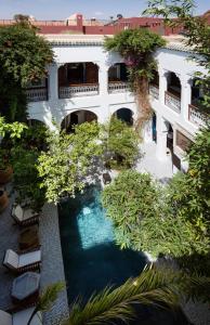 an aerial view of a building with a swimming pool at Riad Les Yeux Bleus in Marrakesh
