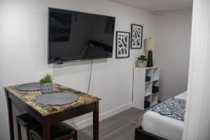 a small room with a table and a bed at Silver Studio in Salt Lake City