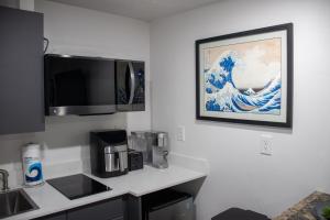 a kitchen with a coffee maker and a microwave at Silver Studio in Salt Lake City
