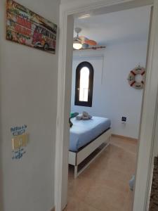 A bed or beds in a room at Casa del Mar Air-conditioned Apartment with Swimming Pools - Corralejo Playa