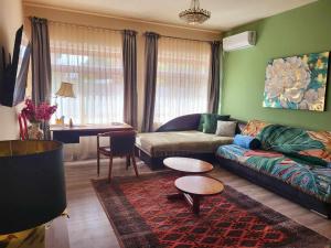 a living room with a couch and a table at Sashalom Apartman in Budapest