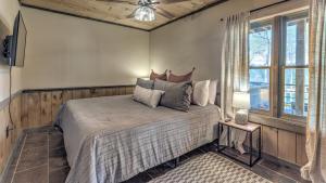 a bedroom with a bed and a window at All Your'n in Blue Ridge