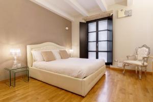 Кровать или кровати в номере Martini Rooms Castello