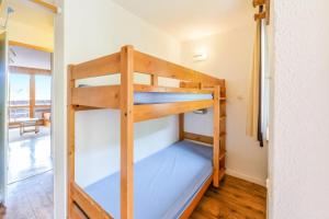 Postel nebo postele na pokoji v ubytování Résidence Les Constellations - maeva Home - Studio 5 Personnes Sélection MAE-8748