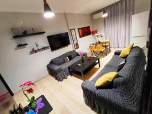 A television and/or entertainment centre at Marlen House Chania