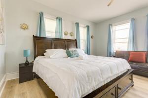 a bedroom with a large bed and a couch at Charming Stoughton Apartment 20 Mi to Boston in Stoughton