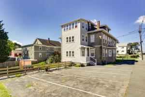 a large house with a parking lot in front of it at Charming Stoughton Apartment 20 Mi to Boston in Stoughton