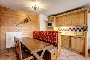 Kuchyňa alebo kuchynka v ubytovaní Résidence Les Alpages de Chantel - maeva Home - Appartement 4 pièces 8 personnes Sélection MAE-1392