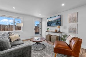 a living room with a couch and a table at OBRILEY in Bend