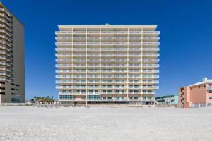 a tall building with a beach in front of it at Crystal Shores Unit 1405 in Gulf Shores