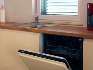 Kuchyňa alebo kuchynka v ubytovaní Apartment Sol