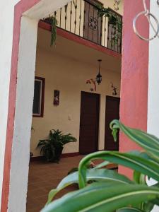 a entry to a house with a balcony at Mia Bonita Hotel Boutique in Tararameo