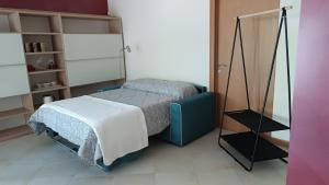 Ένα ή περισσότερα κρεβάτια σε δωμάτιο στο OPENSPACE in Villa Vescovado