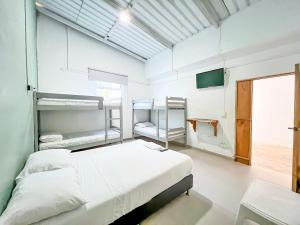 Voodi või voodid majutusasutuse Hotel Palma Grande by Stanza toas