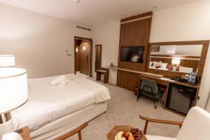 Voodi või voodid majutusasutuse Wassad Hotel Makkah فندق وسد مكة toas