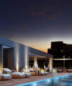 a resort with a swimming pool and a swimming pool at Estudio en Estoril cercano a principales centros de ski in Santiago