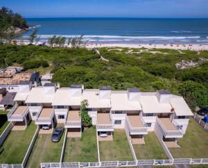 an aerial view of a building at the beach at Ferrugem Beira Mar in Garopaba