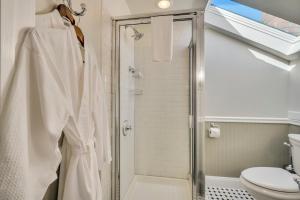 a bathroom with a shower and a toilet at Craftsman Inn in Calistoga