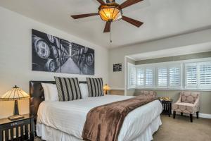 a bedroom with a bed and a ceiling fan at Craftsman Inn in Calistoga