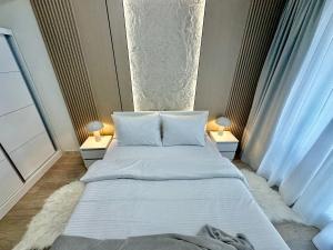 Ένα ή περισσότερα κρεβάτια σε δωμάτιο στο Regina's Sky City Apartment +53 φωτογραφίες