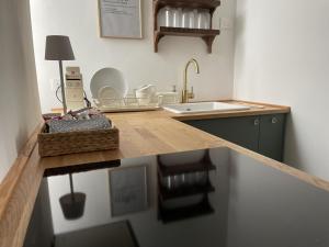 a kitchen with a counter top with a sink at LaViDaViò Suite Room in Bergamo +33 photos