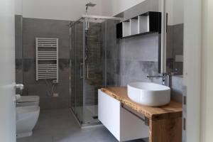 a bathroom with a sink and a shower and a toilet at Corso Italia Luxury Suite in Fondi +58 photos