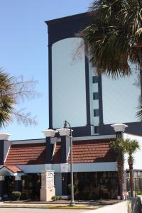 a building with a clock tower on top of it at Blue Palmetto in Myrtle Beach