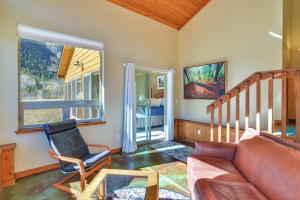 a living room with a couch and a chair at Colorado Mountain Getaway about 12 Mi to Buena Vista! in Nathrop