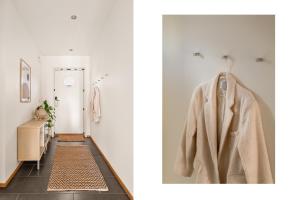 a hallway with a coat hanging on a door at Charming Peacful studio in Bergen