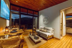 a living room with a couch and a table at Zielo Natural Glamping in Villavicencio